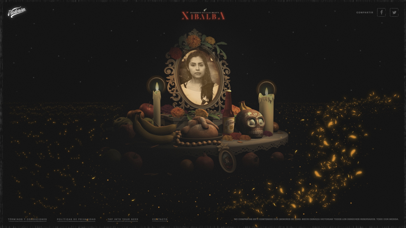 An altar with a photo of a person and candles lit around it