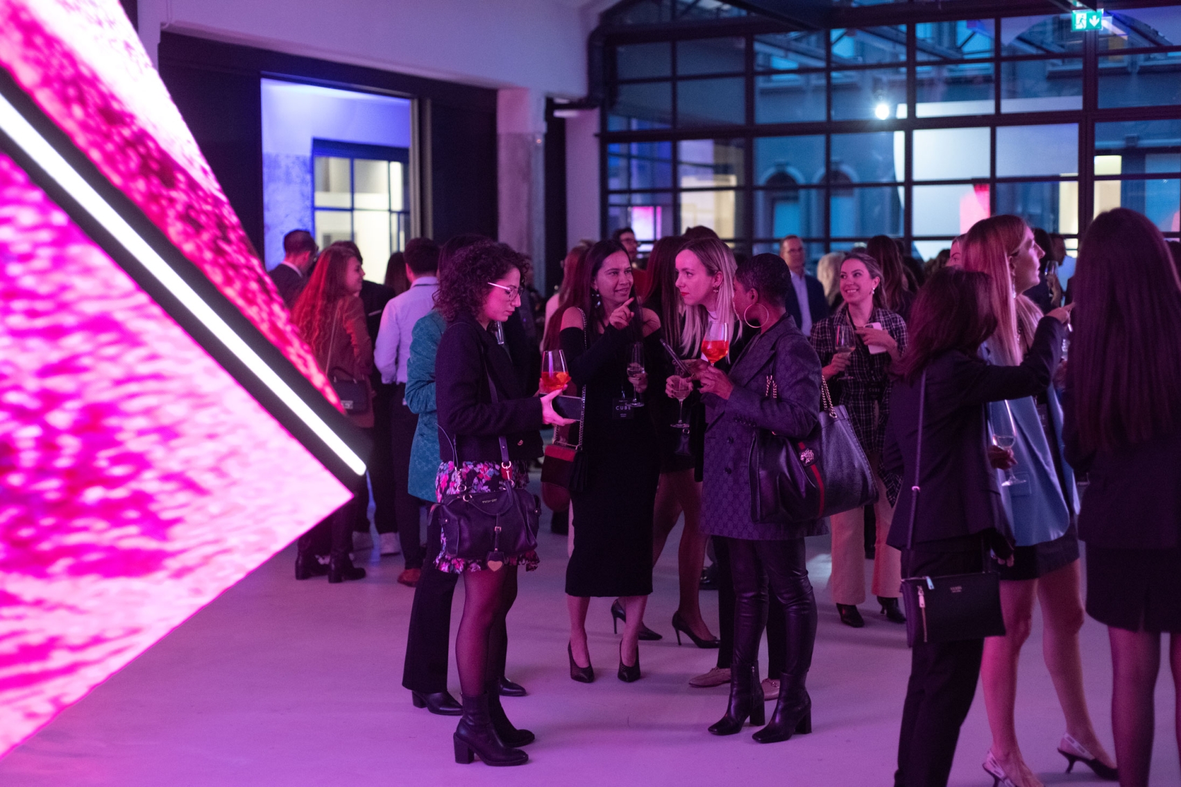 a group of people standing next to each other, masterpiece work of art, looking partly to the left, people enjoying the show