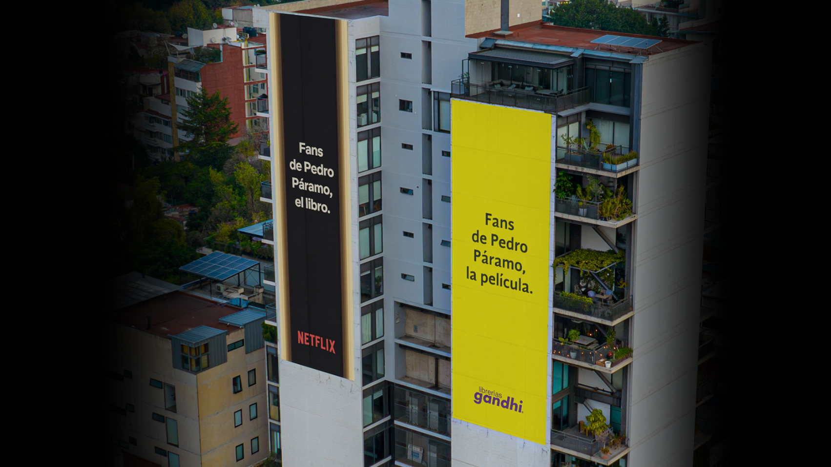 The image features two large billboards on buildings, one advertising a book titled "Pedro Páramo" associated with Netflix, and the other promoting the film adaptation of the same title.
