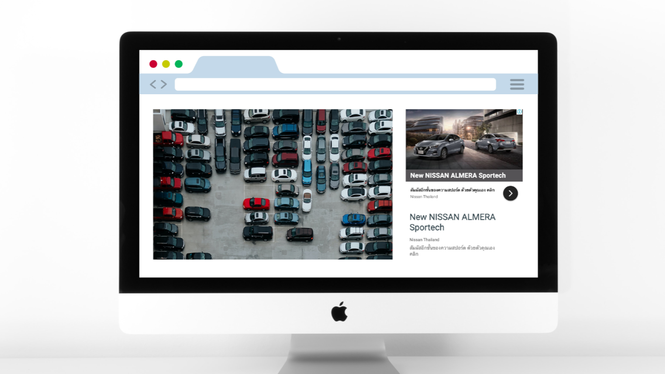 A mac desktop showing a web browser with Nissan ads