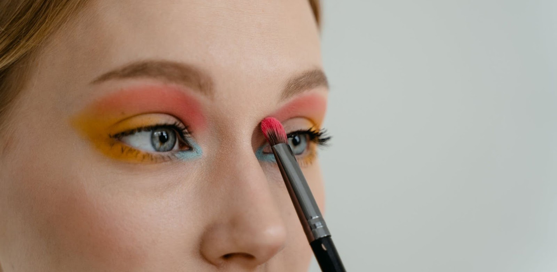 A person doing their eye makeup