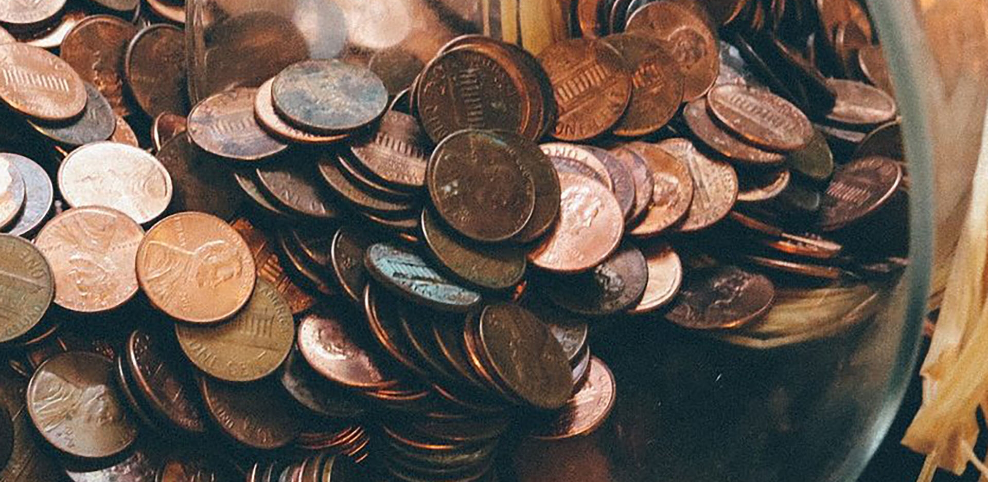 a jar full of pennies falling out