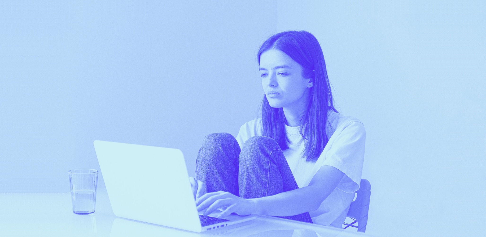 A girl looking at her laptop