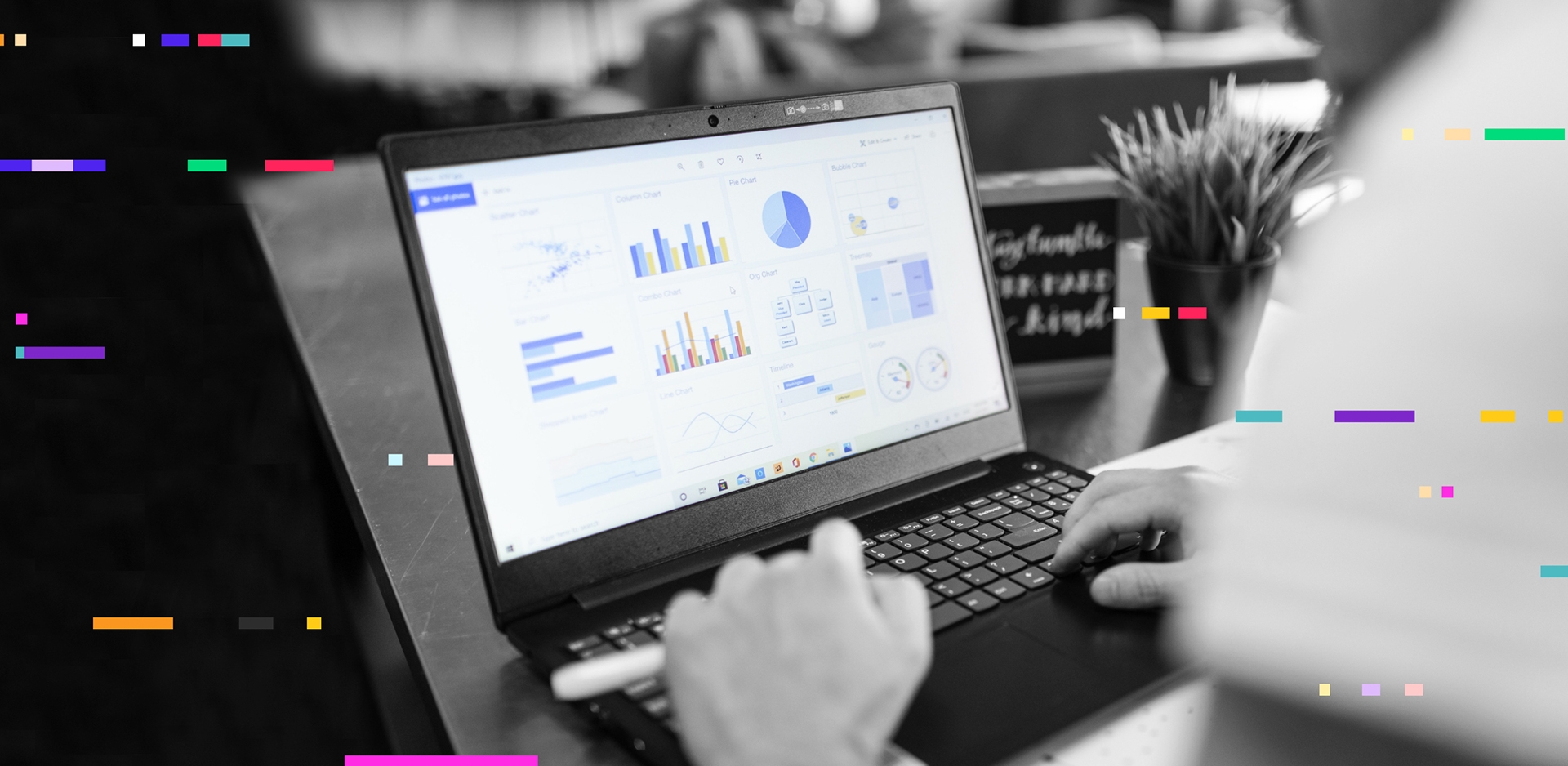 A person working on a computer analyzing data