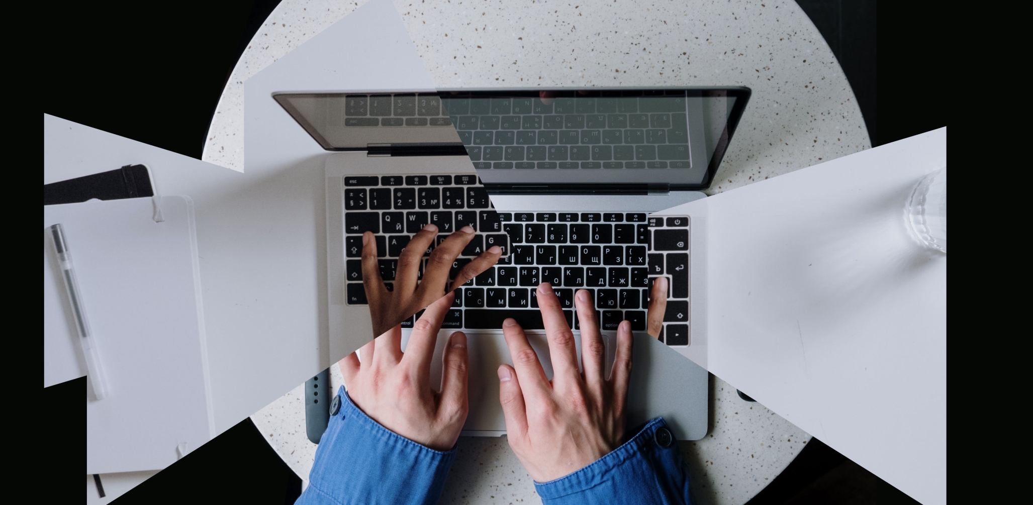 Two hands typing on a laptop