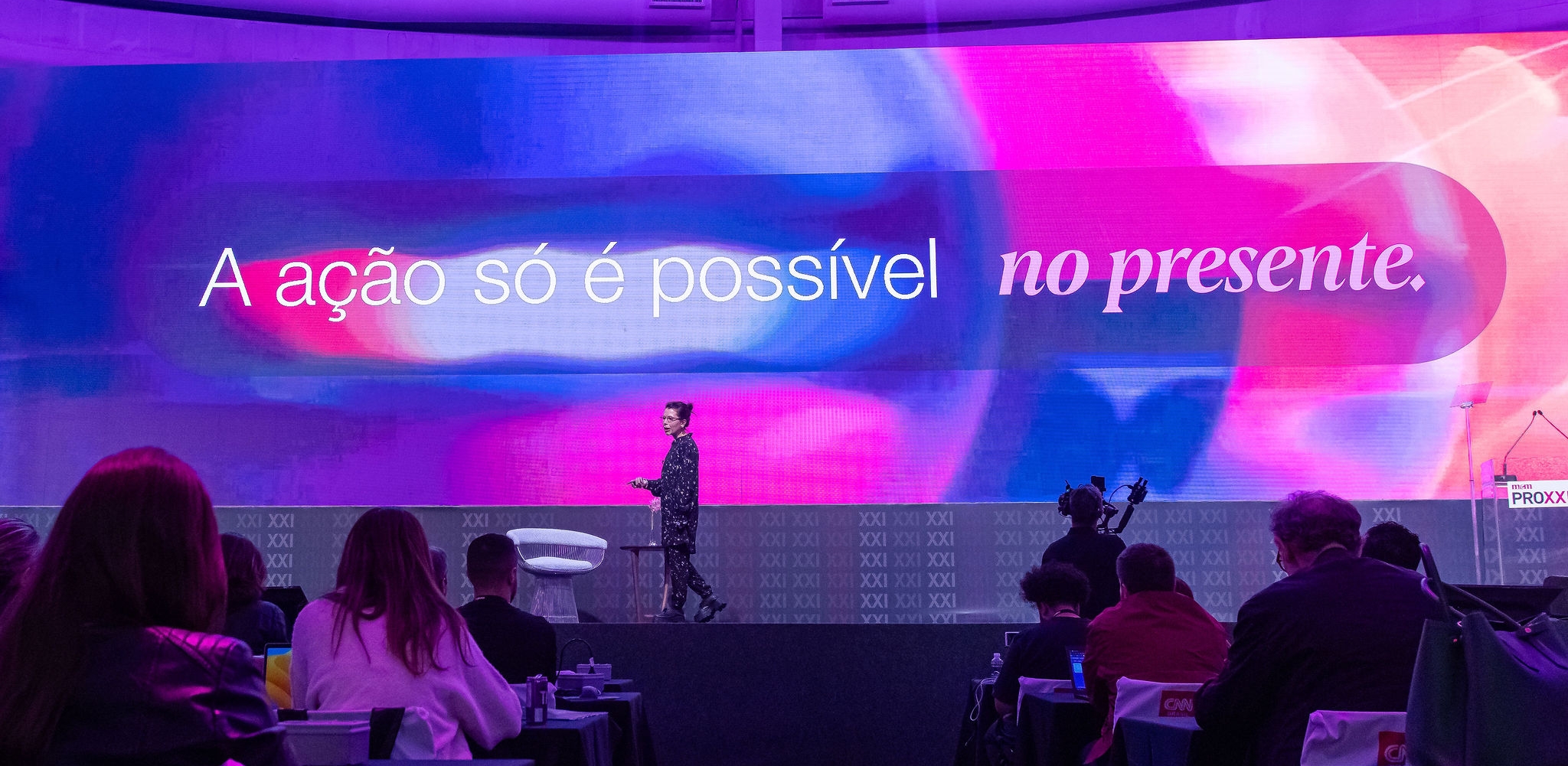 "action is only possible in the present" written on stage