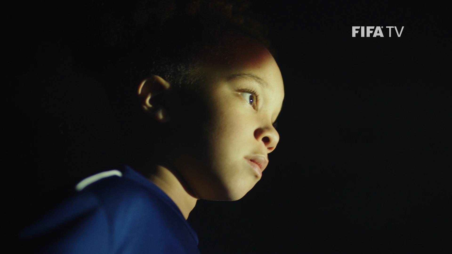 A young player stares off into the night