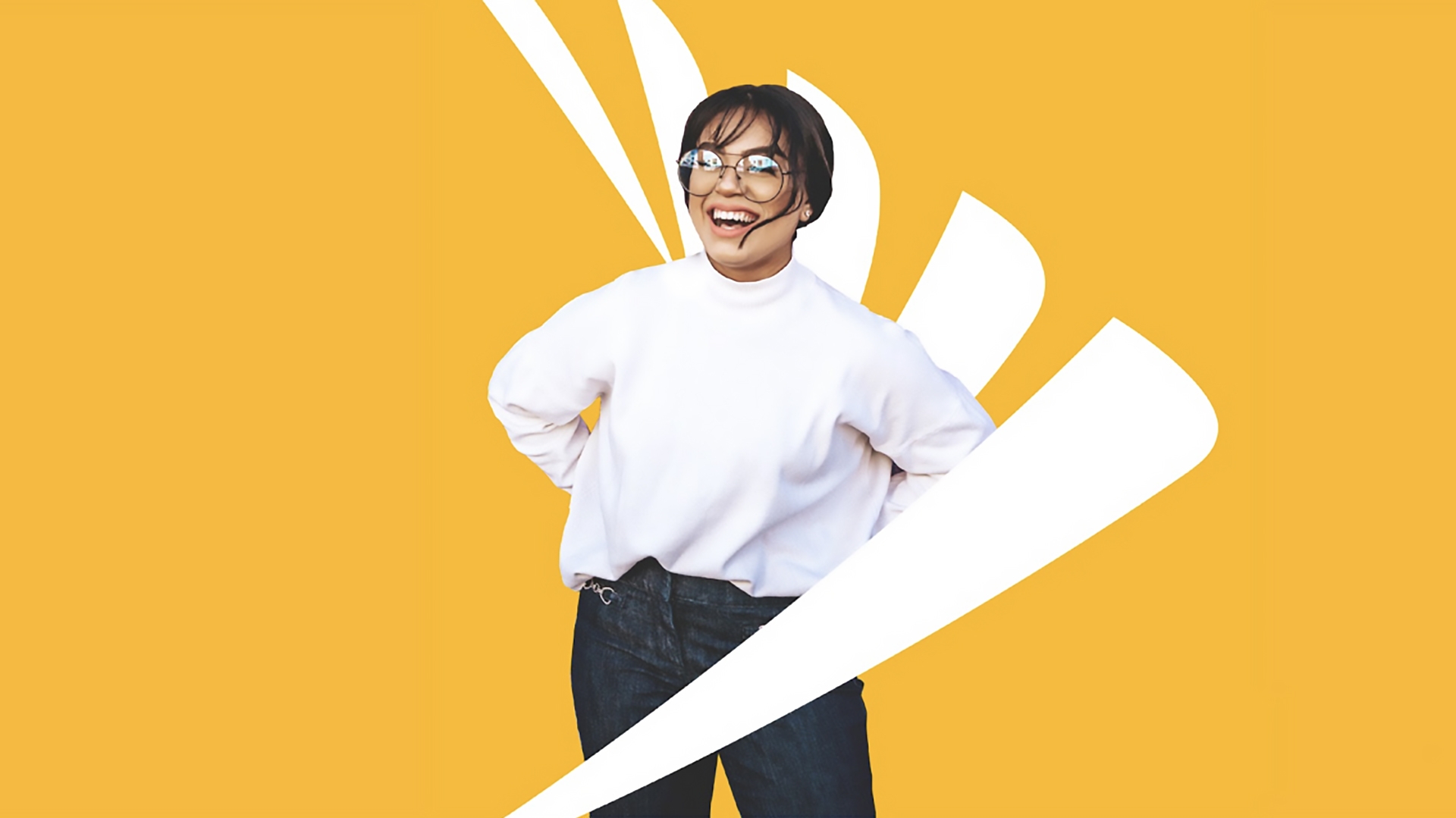 A person smiling and standing in front of a Sprint logo