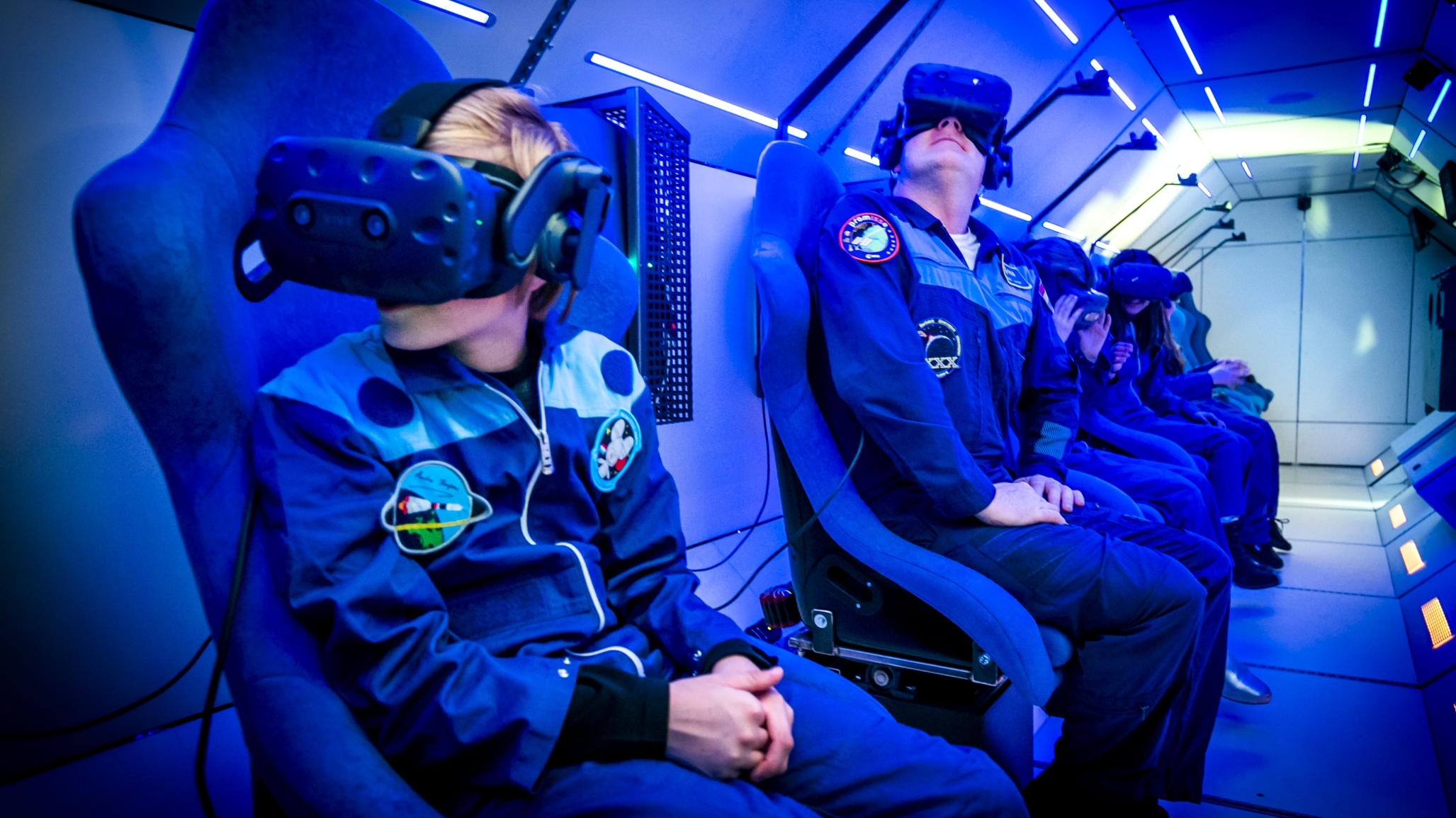 People with VR lenses inside a spaceship
