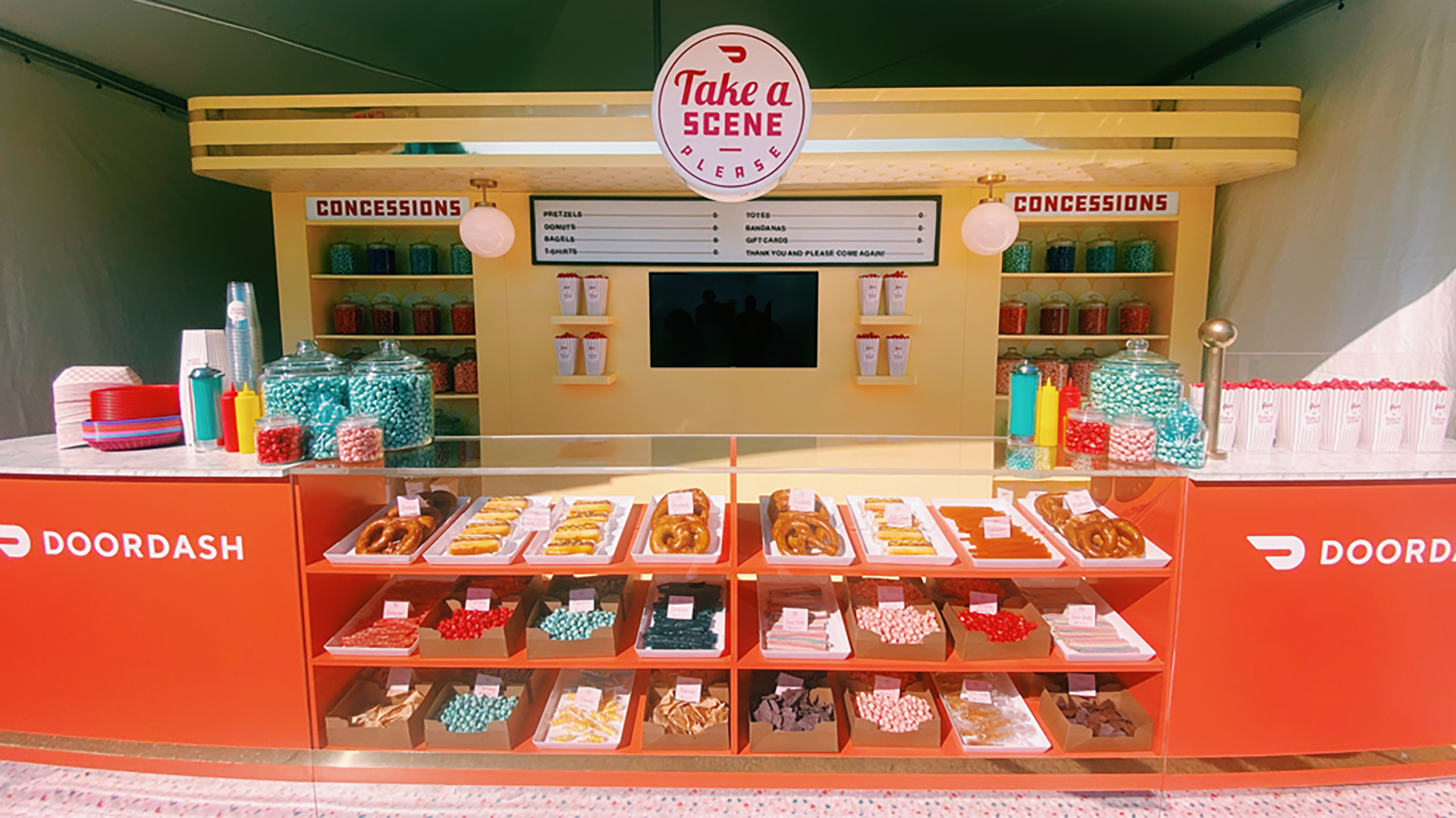 DoorDash branded concession booth with candy and treats