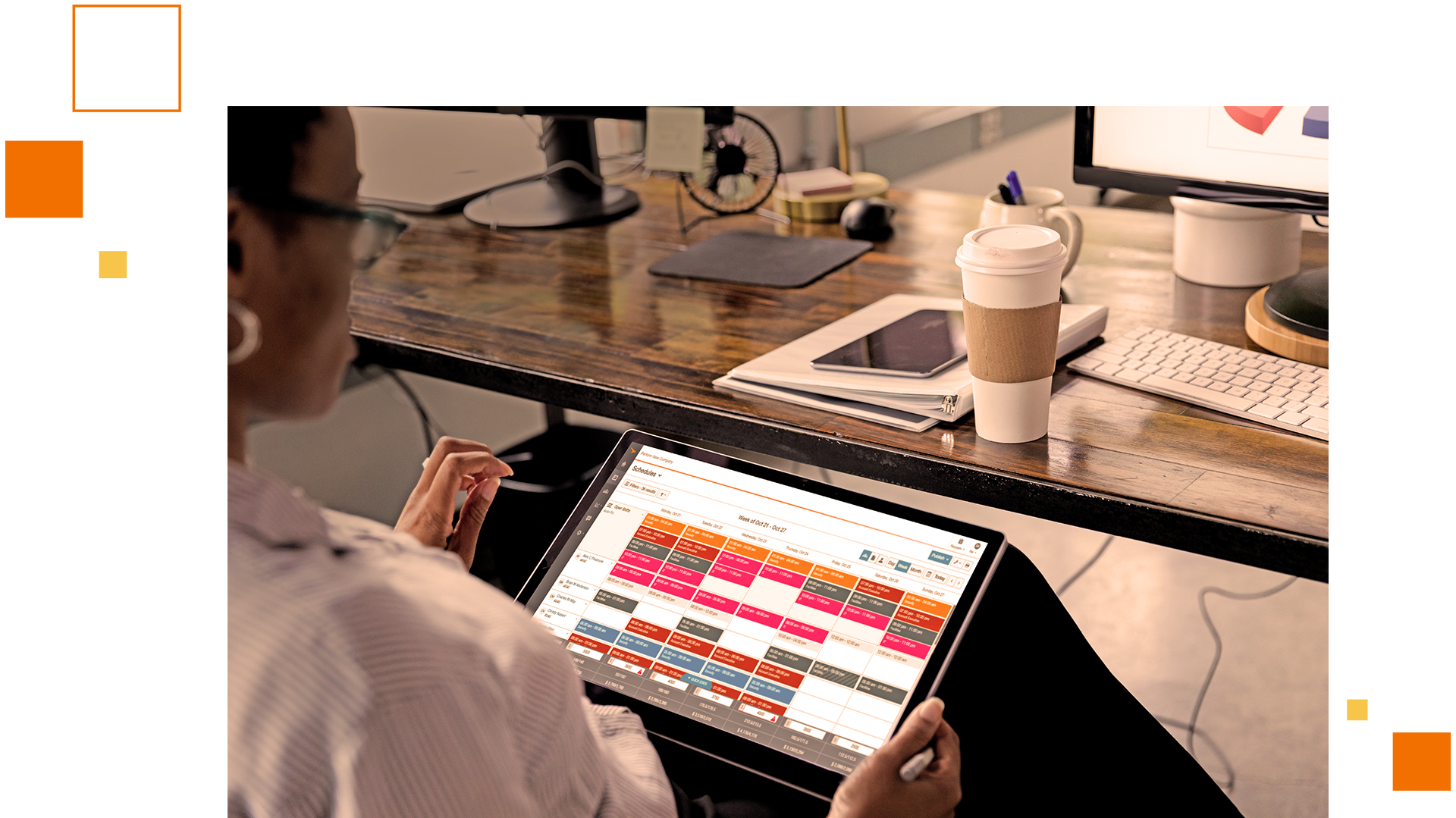 A person using paycor on their tablet at a desk