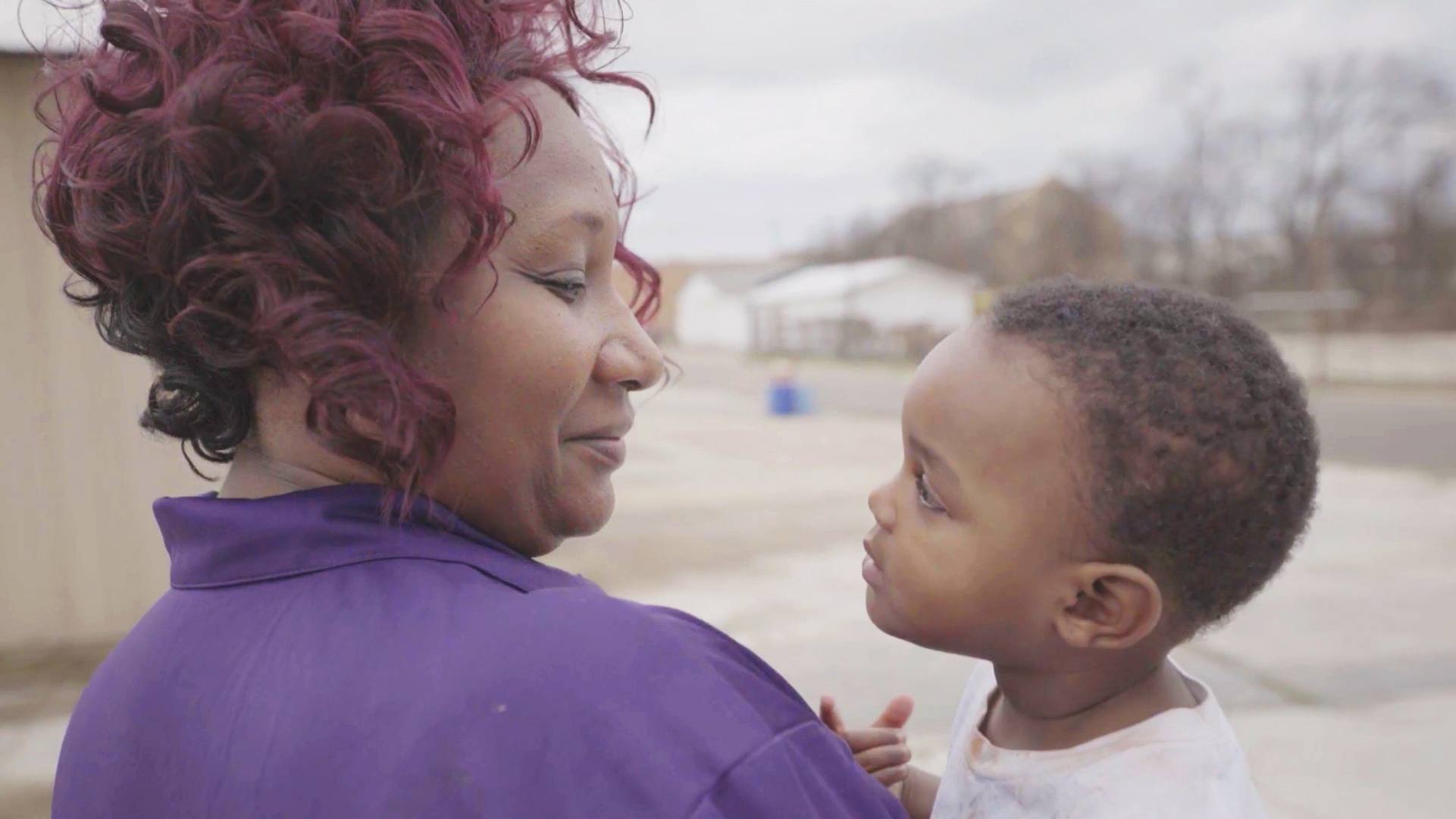 A woman holding a child