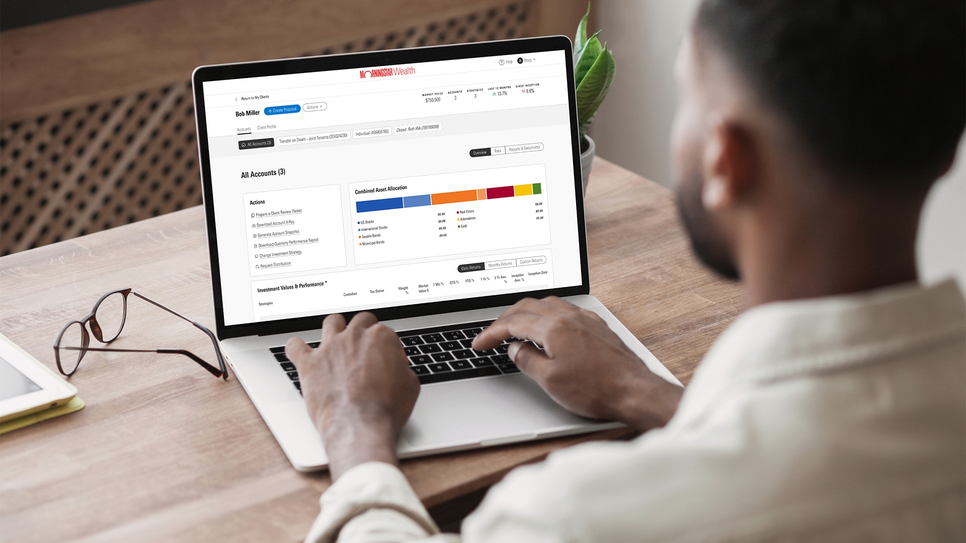 A person working on a laptop using the Morningstar application