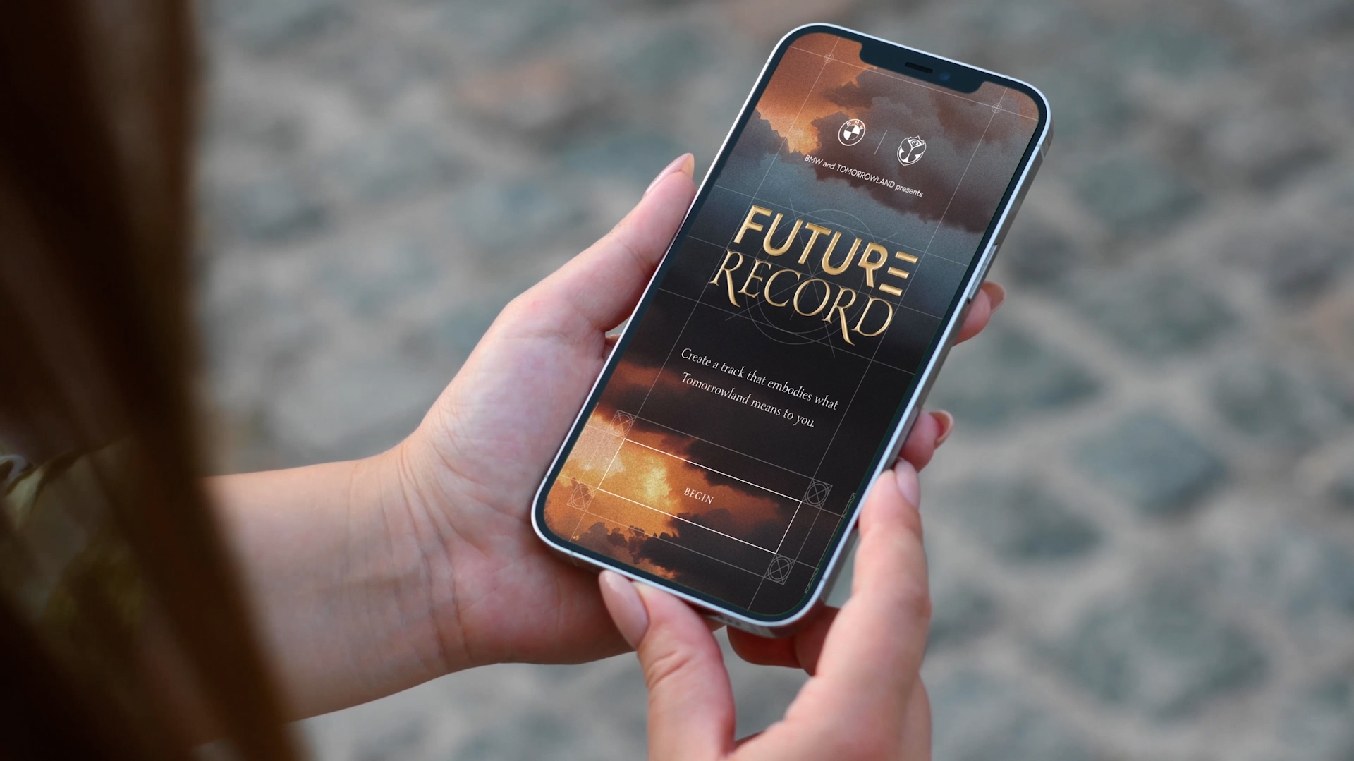 Woman holding a phone and you see the start page of the project 'Future record'