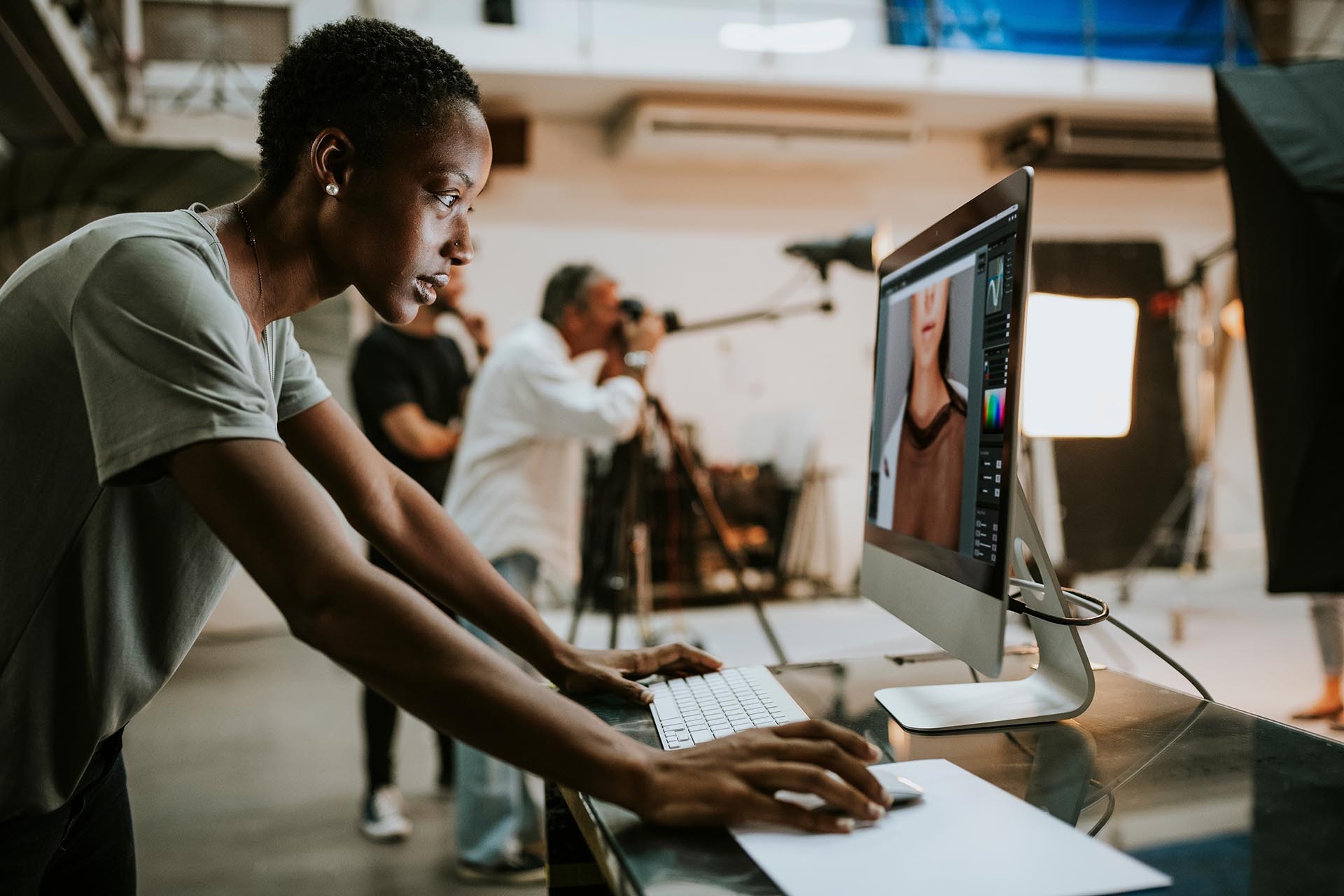 A person working over a desktop designing