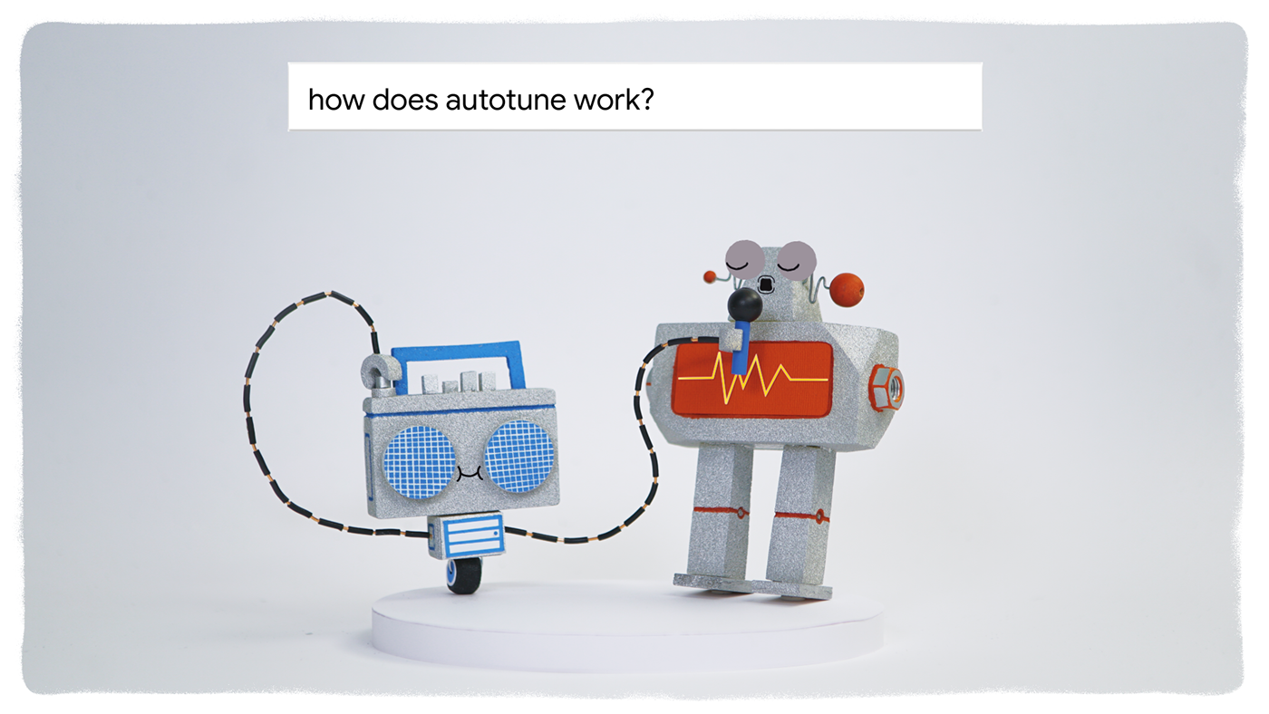 Animation of a robot who is singing in a microphone that is attached to a radio. There is a google search bar at the top that holds the lines: how does autotune work?