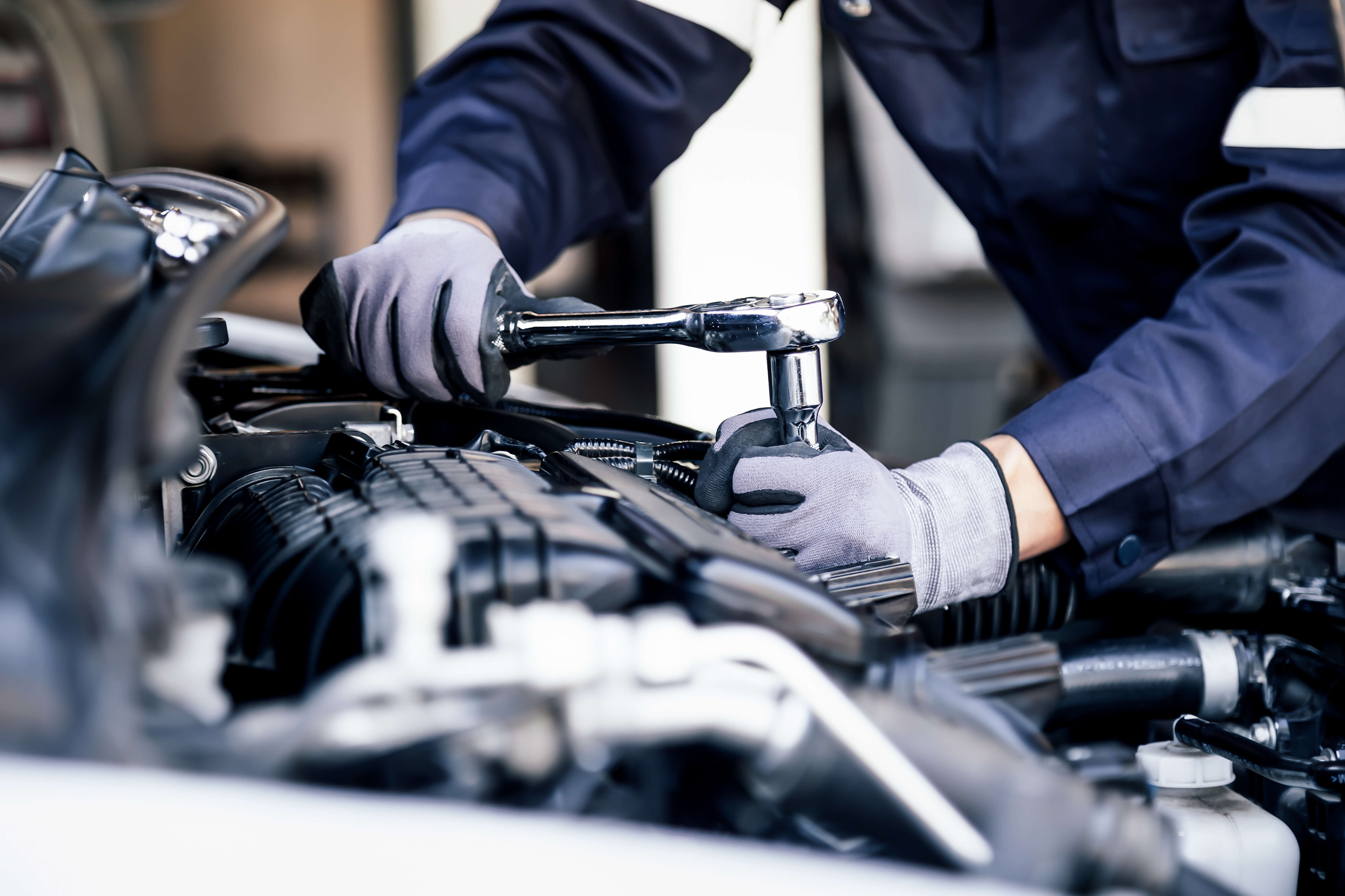 Car mechanic working on car