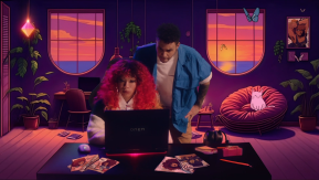 A woman sitting behind a Omen laptop and a man standing behind her looking over her shoulder. The background of the image is illustrated. It shows a living room with a cat on a chair and plants. All in purple and orange tinted colours.