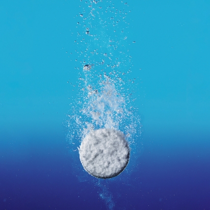 a pill being dropped in water