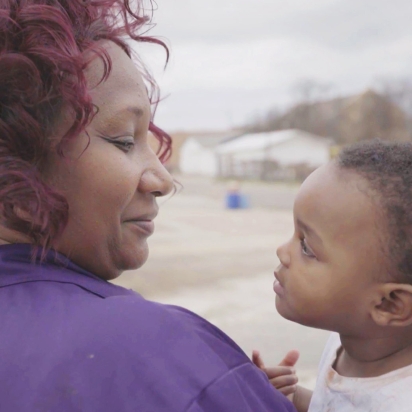 A woman holding a child