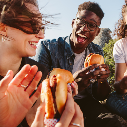 A group of people enjoying hamburgers