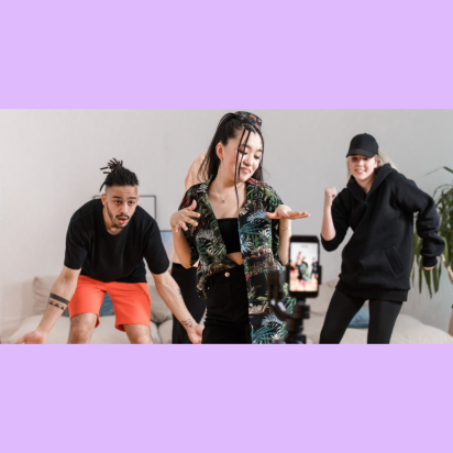 Young students dance in front of a phone