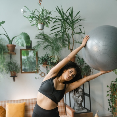 black woman doing exercises with a ball