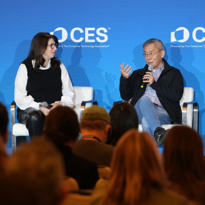 two people sitting on a stage at CES 2025