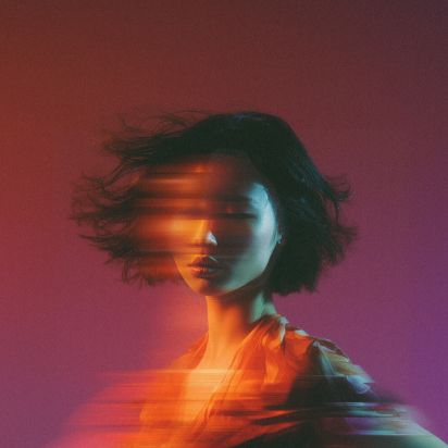 woman with digital effect that makes it look like a long exposure photo where she is moving horizontally