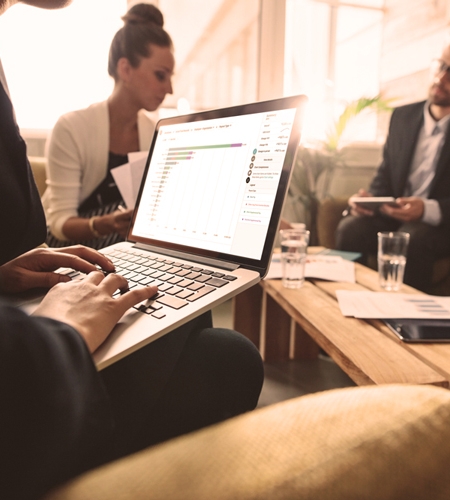 A person in a meeting on their laptop
