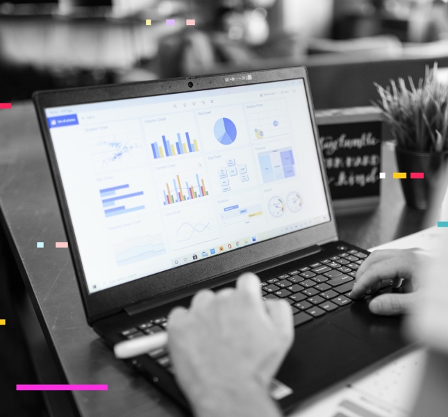 A person working on a computer analyzing data