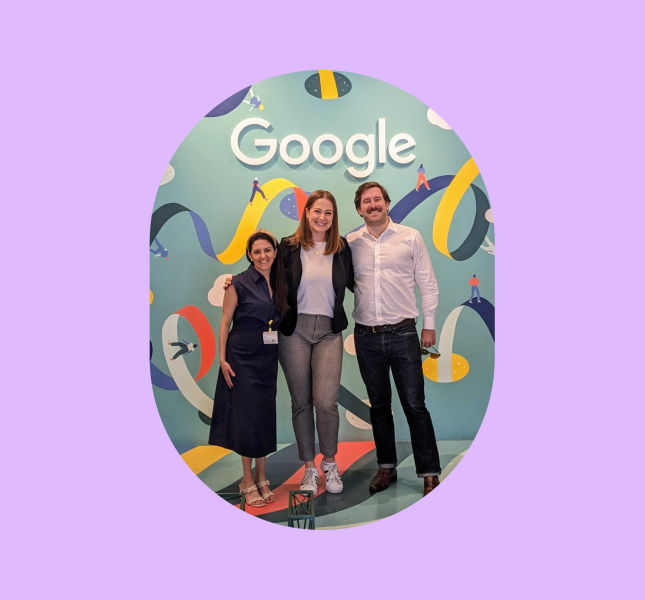 Three people in front of Google sign at GML 2024 event