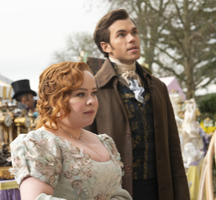 The image features a woman in a pastel dress and a man in a dark coat, sharing a moment of curiosity in a lively outdoor marketplace filled with vintage items and colorful tents.