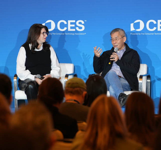 two people sitting on a stage at CES 2025