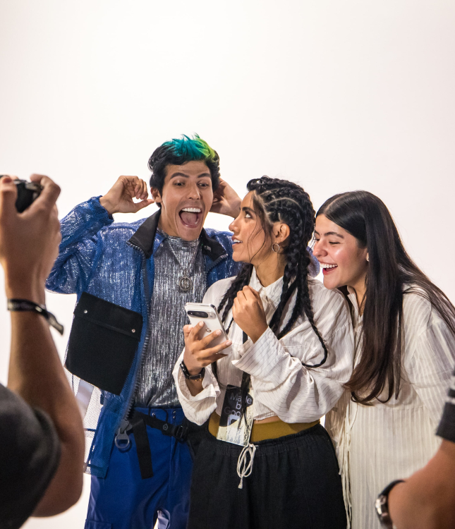 Experiential marketing event attendees are filmed interacting with a Google device, highlighting the creation of multi-modal content (video, social media, case study image) for a brand activation strategy.