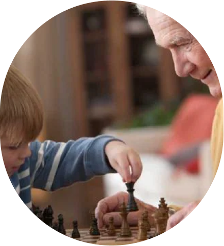 A person playing chess with a kid