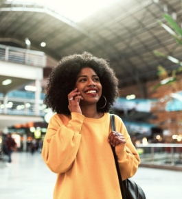 A person walking and talking on a cellphone