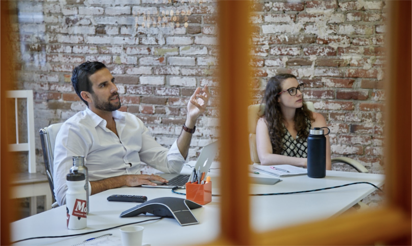 Two performance.monks in a meeting
