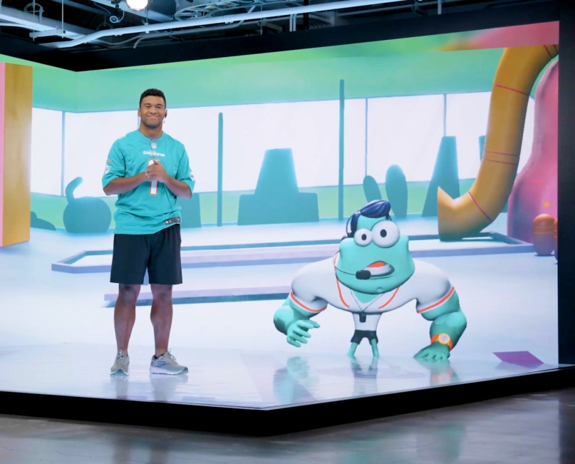 Tua Tagovailoa and Terry on a production stage filming