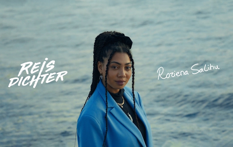 Portret of the Travel Poet. In the left side of the image you see the title 'Reisdichter'. On the right side her autograph.