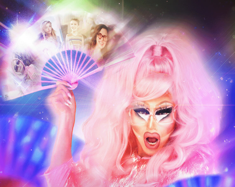 Trixie Mattel holding a fan that has faces from HBO Max shows.