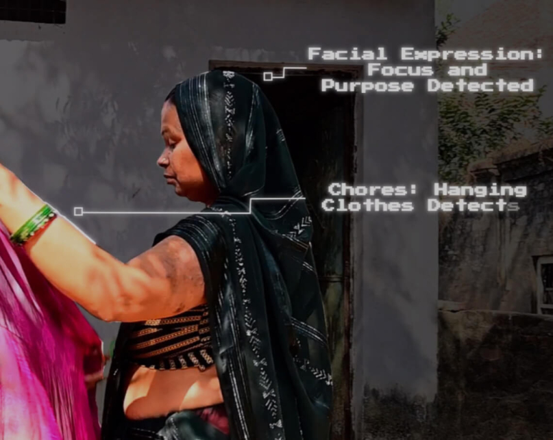 A Indian woman folding clothes at home.