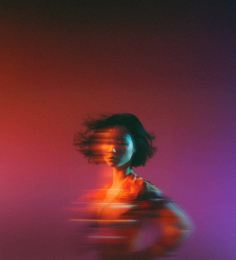 woman with digital effect that makes it look like a long exposure photo where she is moving horizontally