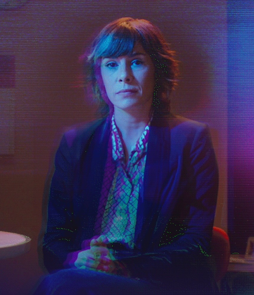 Digital looking image of a women who sits in a living room. The logo from Sephora appears in white.