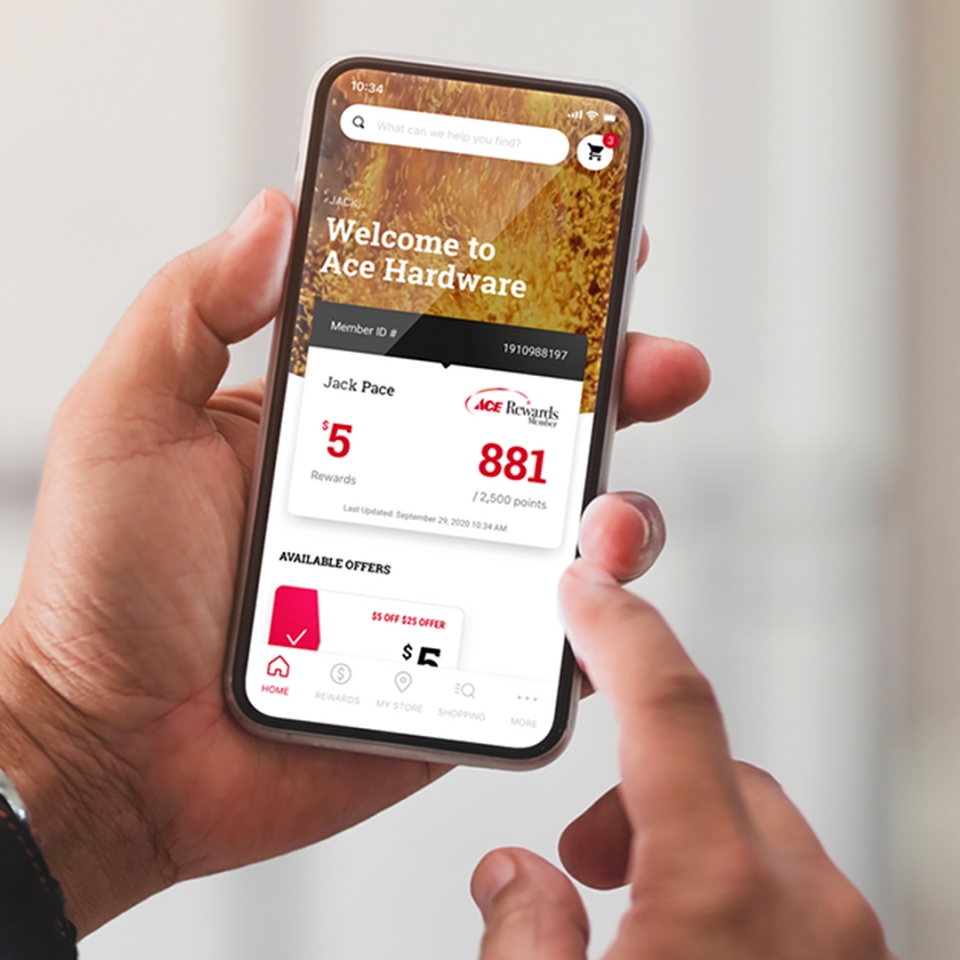 a hand holding a smart phone with the Ace Hardware app on the screen