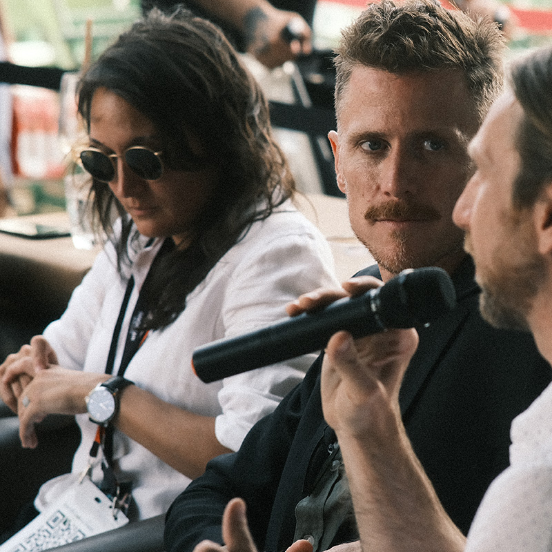 employees at Cannes talking on a panel