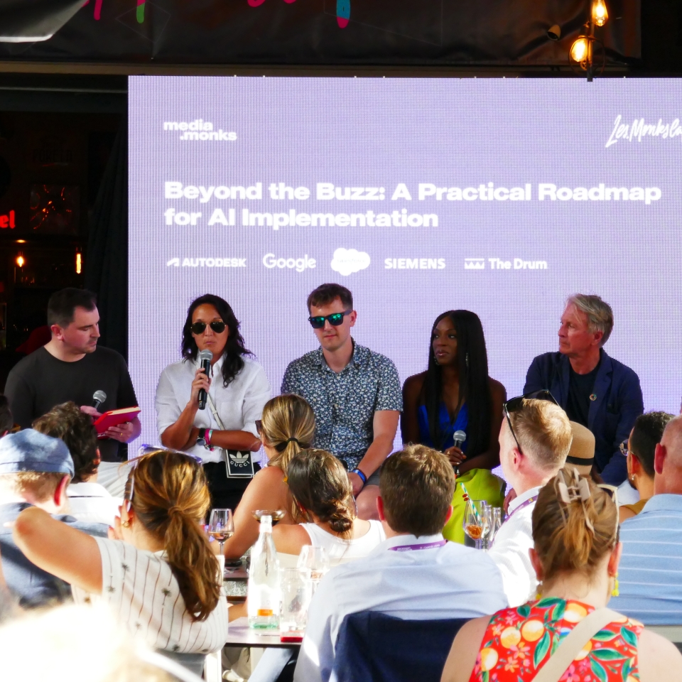 A presentation panel at Cannes with 5 speakers discussing modern marketing