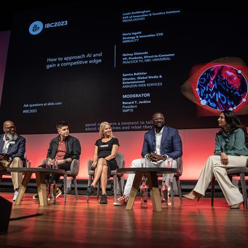 People on a panel at IBC talking