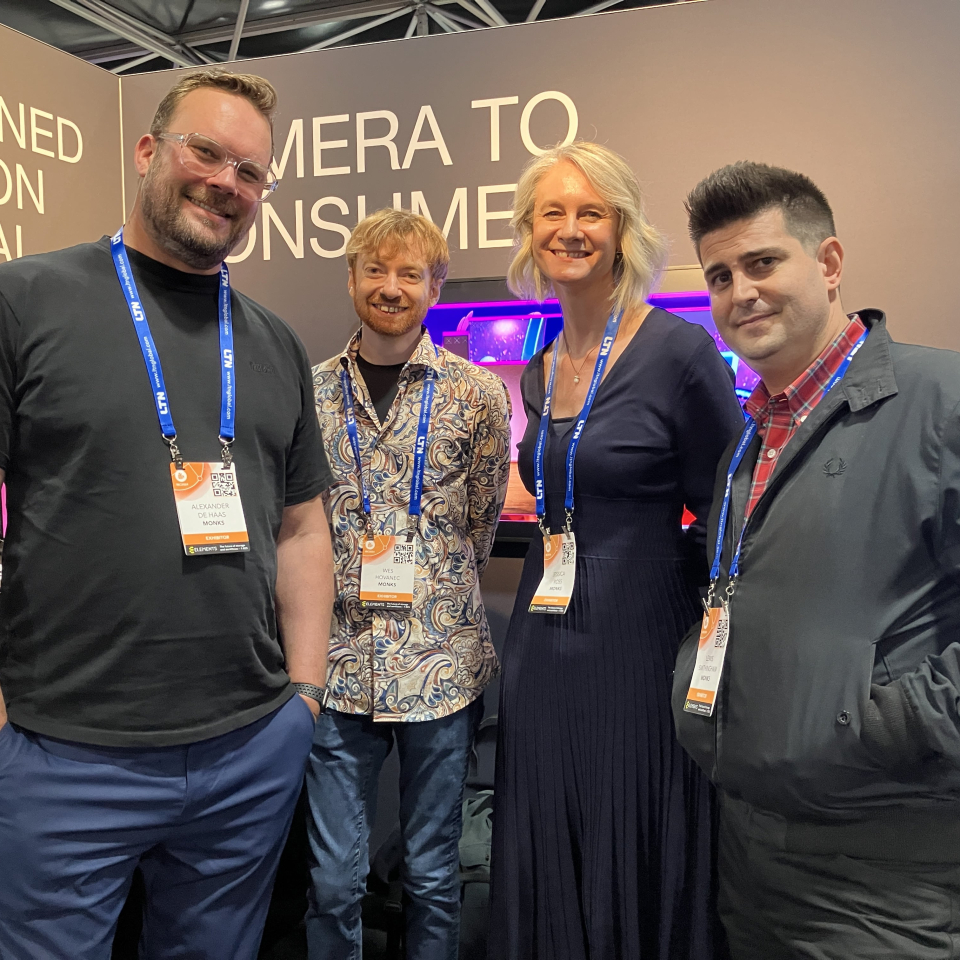 A group of Monks at IBC within a booth