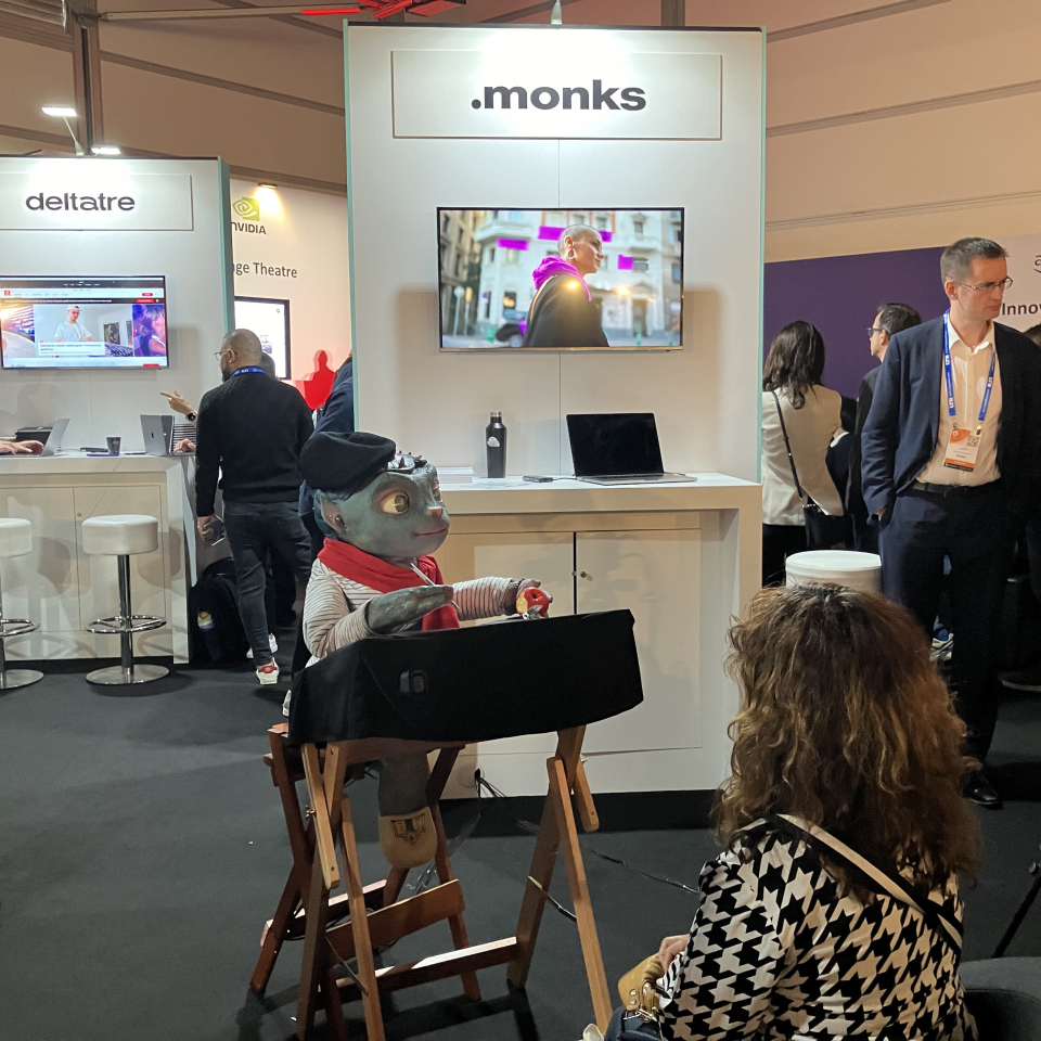 Sir Martian the alien sitting at a booth drawing a person's portrait